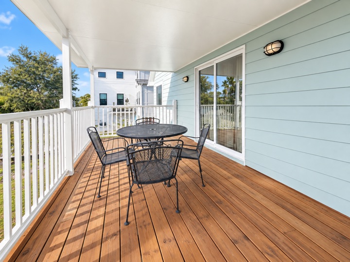 Covered deck with an outdoor table and chairs